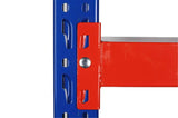 Close-up of blue metal shelving frame with red beam connector in industrial storage rack