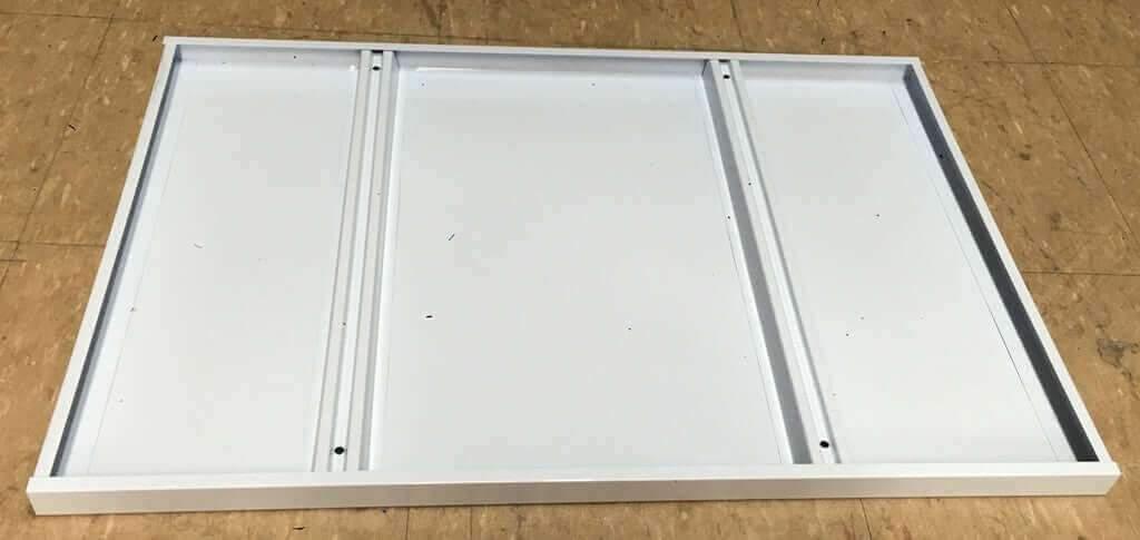 White heavy-duty extra shelf deck for Falcon Long Span shelving on wood floor